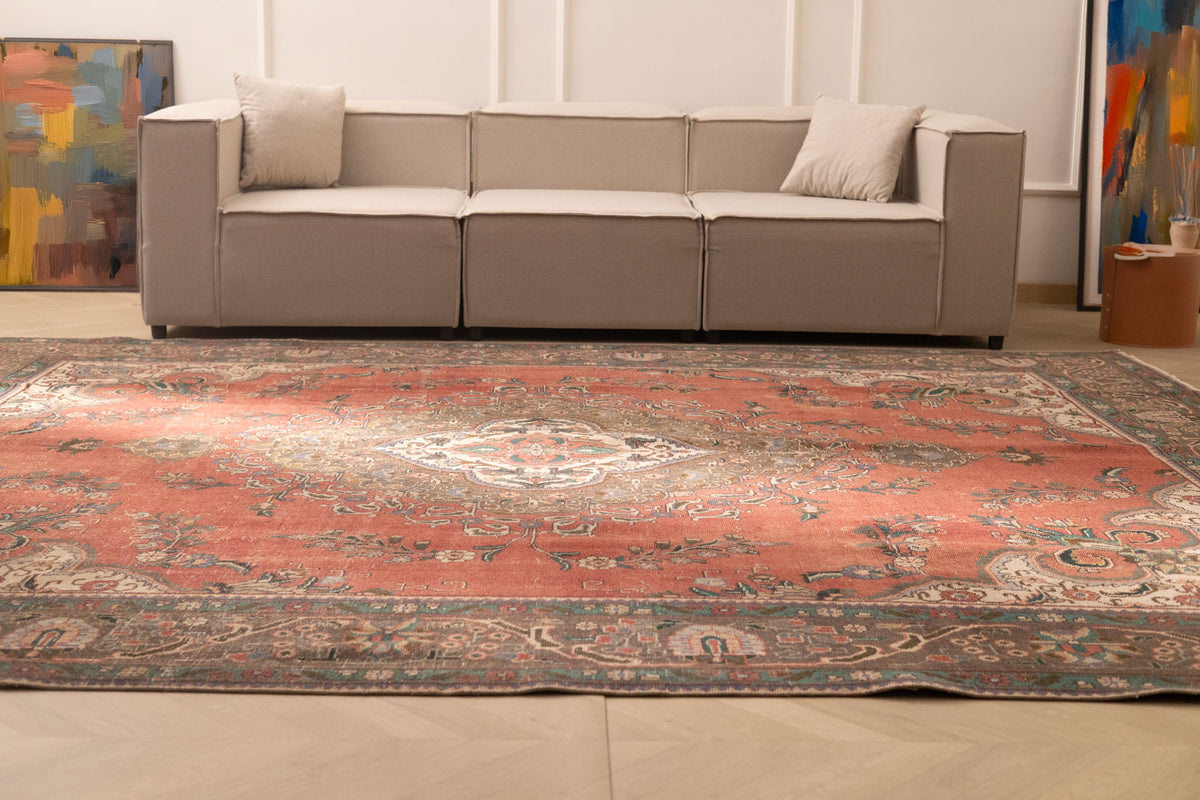 Oversized 9.7x12.1 ft handmade wool and cotton Persian rug featuring a red floral pattern in a traditional bohemian style.