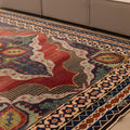 Handmade 7x10 ft Persian-style wool and cotton rug with red and navy floral patterns in a traditional bohemian design.