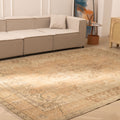 Oversized beige and brown Persian-style wool-cotton rug with traditional floral patterns in a modern living room.