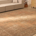 Oversized 9.8x12.8 ft Persian-style wool and cotton rug in orange and brown with traditional floral patterns.