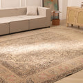 Oversized beige Persian-style wool and cotton area rug featuring intricate geometric and floral motifs in a living room.