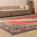 Oversized 9.7x12.6 ft Persian-style wool and cotton area rug featuring traditional red and navy floral patterns.