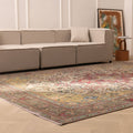 Oversized Persian-style wool and cotton area rug featuring red and floral patterns in a bohemian living room.