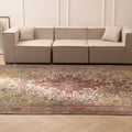 Oversized Persian-style wool and cotton rug featuring intricate red and floral patterns in a traditional bohemian design.