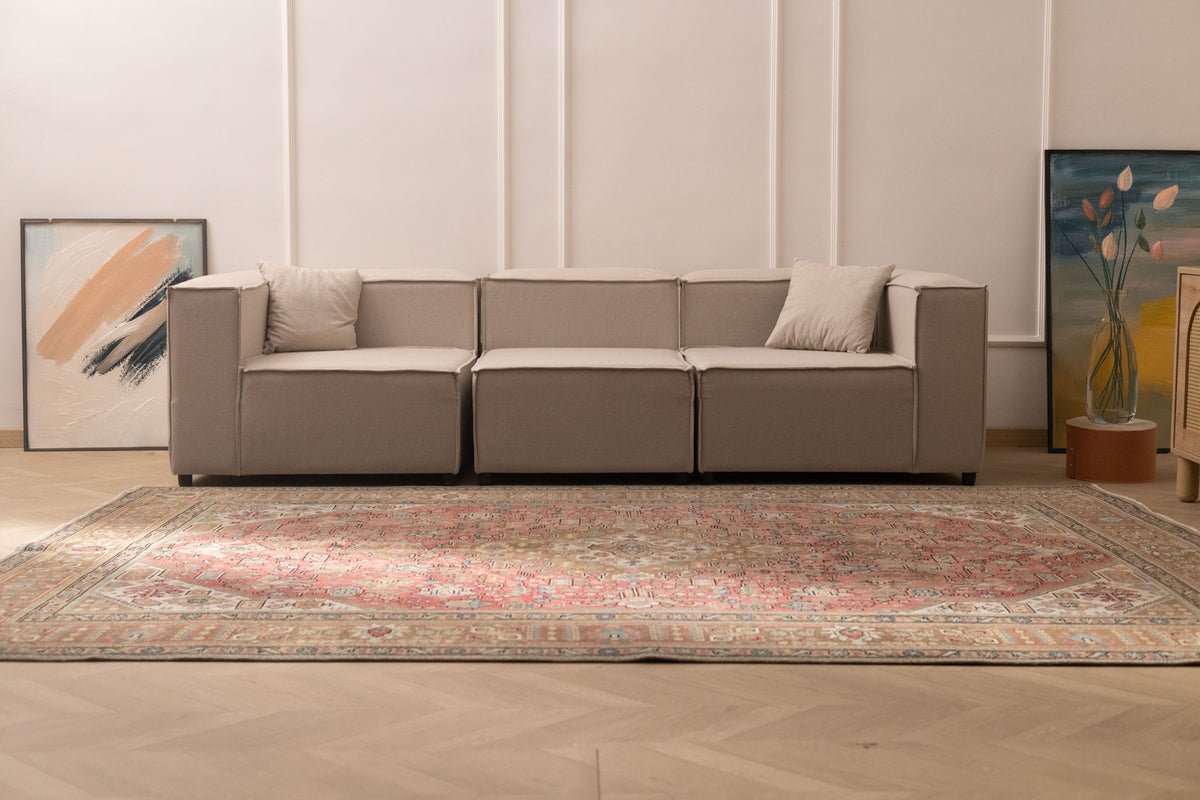 Oversized Persian-style wool and cotton area rug in red and brown with traditional floral motifs and maximalist patterns.