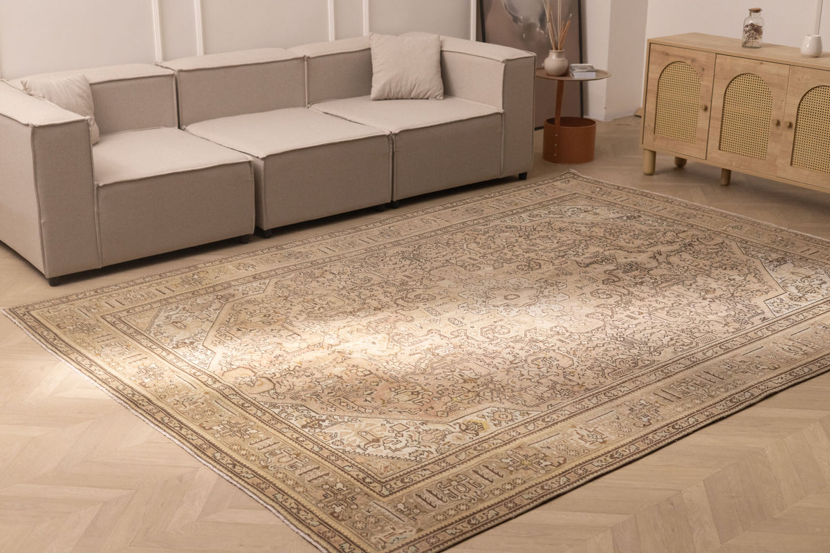 Oversized 7.9x11 ft Persian-style wool and cotton rug in brown and beige with traditional floral patterns.