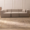 Oversized 7.9x11 ft Persian-style wool and cotton area rug in beige and brown with traditional floral patterns.