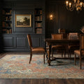 Brown Persian rug in a dining room