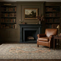 Brown Persian rug in a study