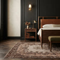 Brown Turkish rug in a bedroom