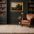 Green Turkish rug in a library