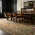 Orange rug in a dining room