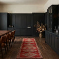 Red Persian runner rug in a styled room