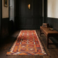 Red Persian runner rug in a styled room