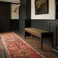 Red Persian runner rug in a styled room