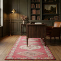 Pink Persian runner rug in a study