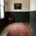 Red Persian runner rug in a styled room