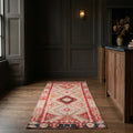 Red Persian runner rug in a styled room