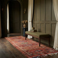 Red Persian runner rug in a den