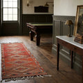 Red Persian runner rug in a styled room