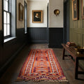 Orange Persian runner rug in a corridor
