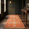 Orange Persian runner rug in a styled room