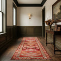 Red Persian runner rug in a den