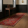 Red Persian runner rug in a hallway