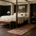 Red Persian runner rug in a bedroom