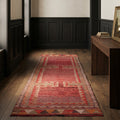 Red Persian runner rug in a styled room
