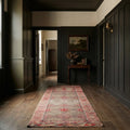Red Persian runner rug in a hallway