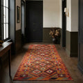 Orange Persian runner rug in a styled room