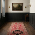 Pink Persian runner rug in a den