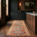 Orange Persian runner rug in a kitchen