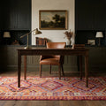 Orange Persian runner rug in a study