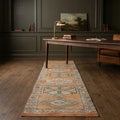 Orange Persian runner rug in a styled room