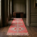 Red Persian runner rug in a library