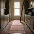 Pink Persian runner rug in a library