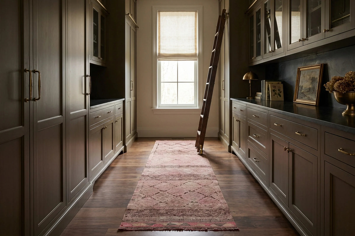Pink Persian runner rug in a library