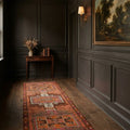 Orange Persian runner rug in a styled room