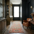 Orange Persian runner rug in a styled room