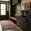 Brown Persian runner rug in a styled room