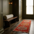 Red Persian runner rug in a styled room