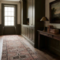 Brown Persian runner rug in a styled room