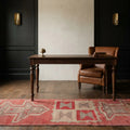 Red Persian runner rug in a study