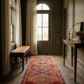 Orange Persian runner rug in a den