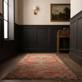 Pink Persian runner rug in a styled room