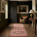 Pink Persian runner rug in a den