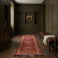Red Persian runner rug in a corridor