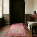 Red Persian runner rug in a library